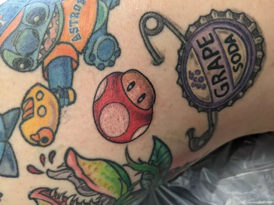 Choosing the right tattoo, Katy decided to get a Nintendo character inked on her thigh.