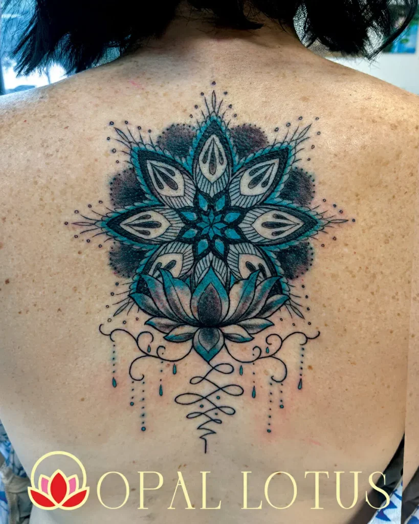 A woman's back adorned with a lotus flower tattoo, part of a teacher giveaway event in the Houston Katy Area.